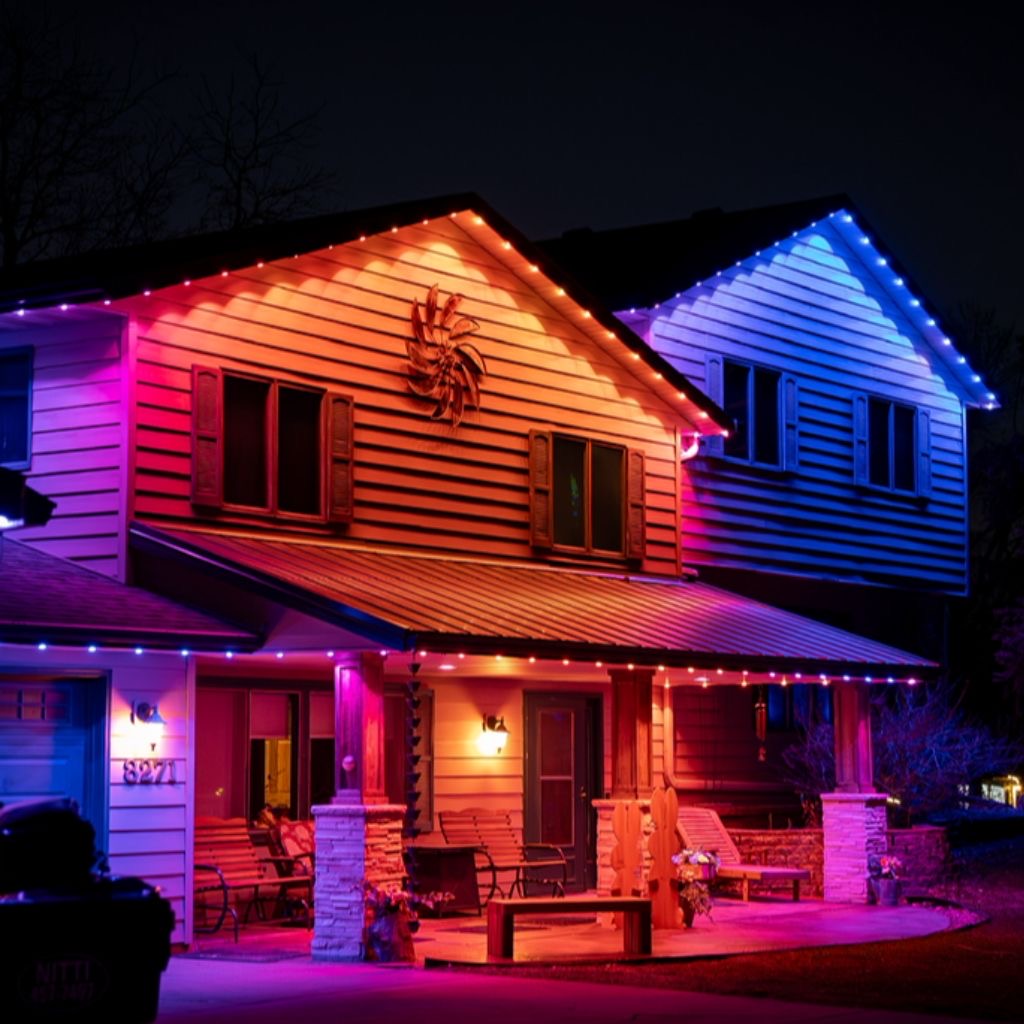 Multicolor permanent lighting on a home with a covered front porch